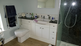 En-suite with fitted cupboards